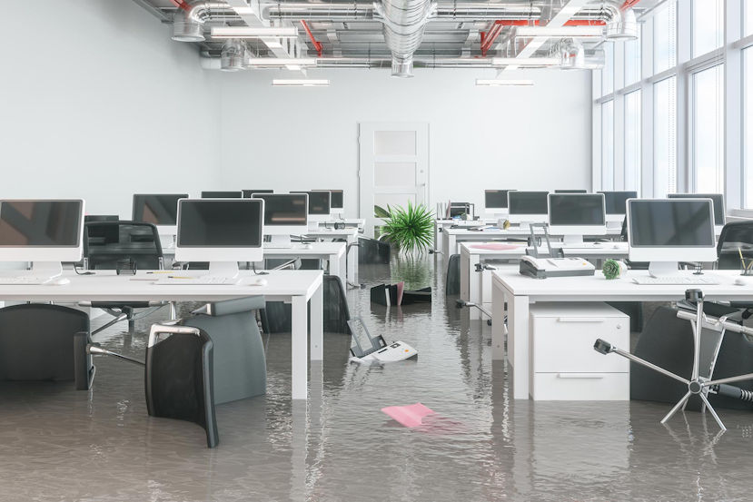 RemoteOver.com is responding to an office flood. There are several desks with computers on top. There is about one inch of water flooding the floor. We provide disaster recovery in these scenarios.