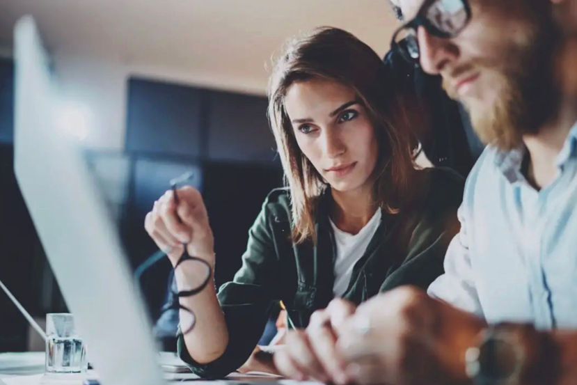 RemoteOver.com is providing IT Consulting to a client. They are both looking at a laptop.